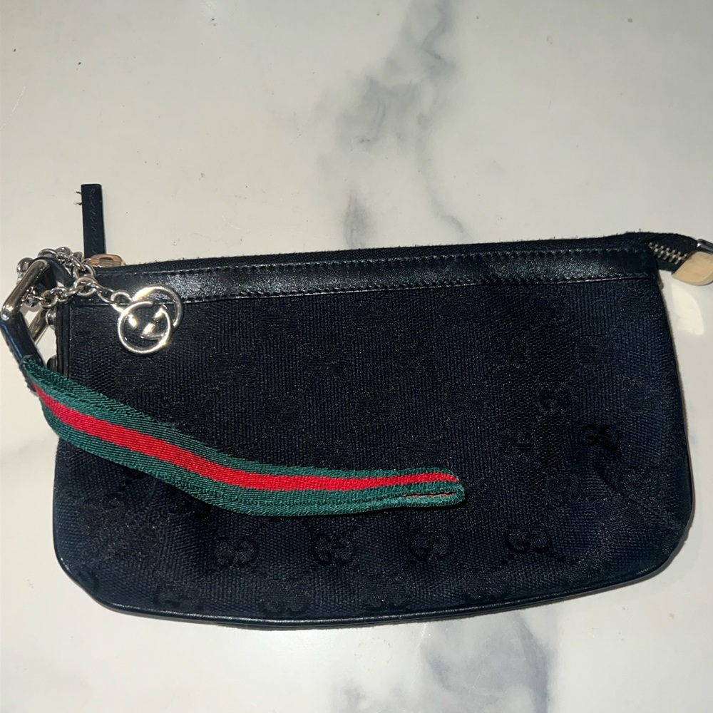 Authentic Gucci Black Monogram wristlet. Discontinued. excellent condition